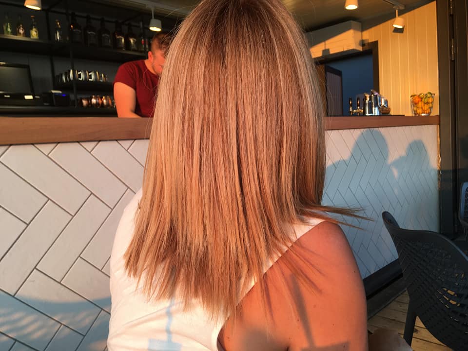 Client getting a haircut in a modern salon